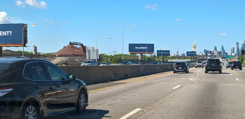 Billboards along I-95 in Philadelphia. (Ella Lathan for Billy Penn)