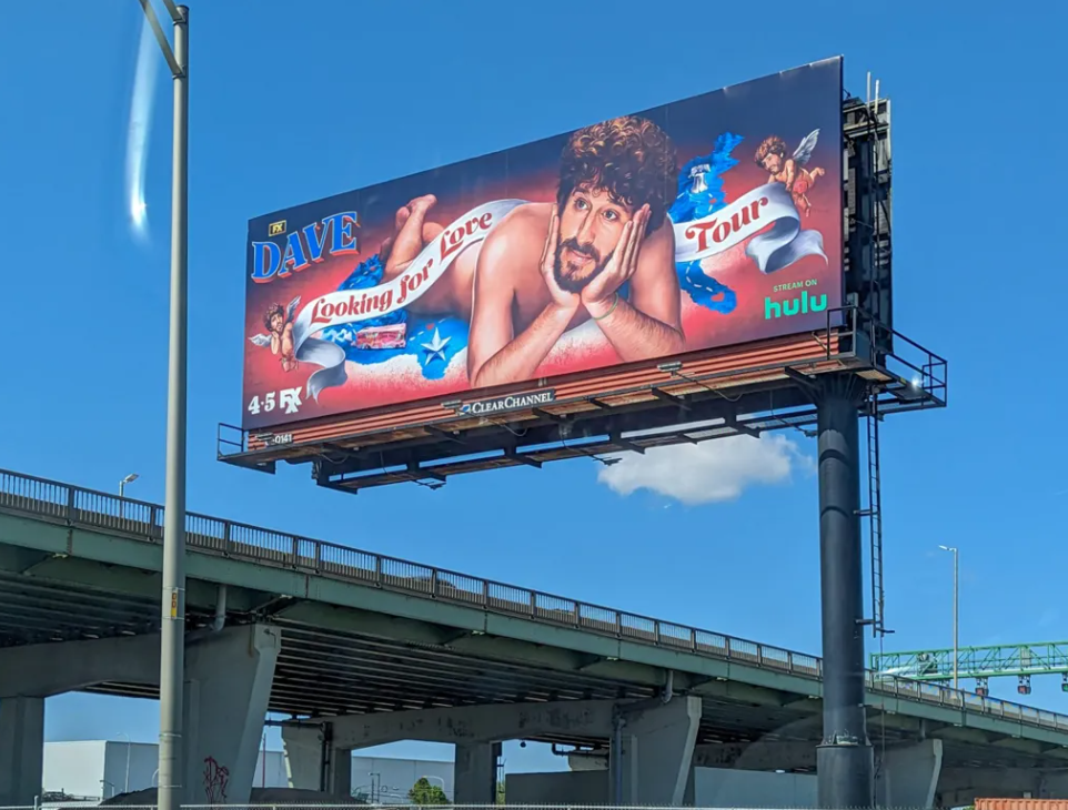 Billboard for DAVE along I-95 in Philadelphia. (Ella Lathan for Billy Penn)