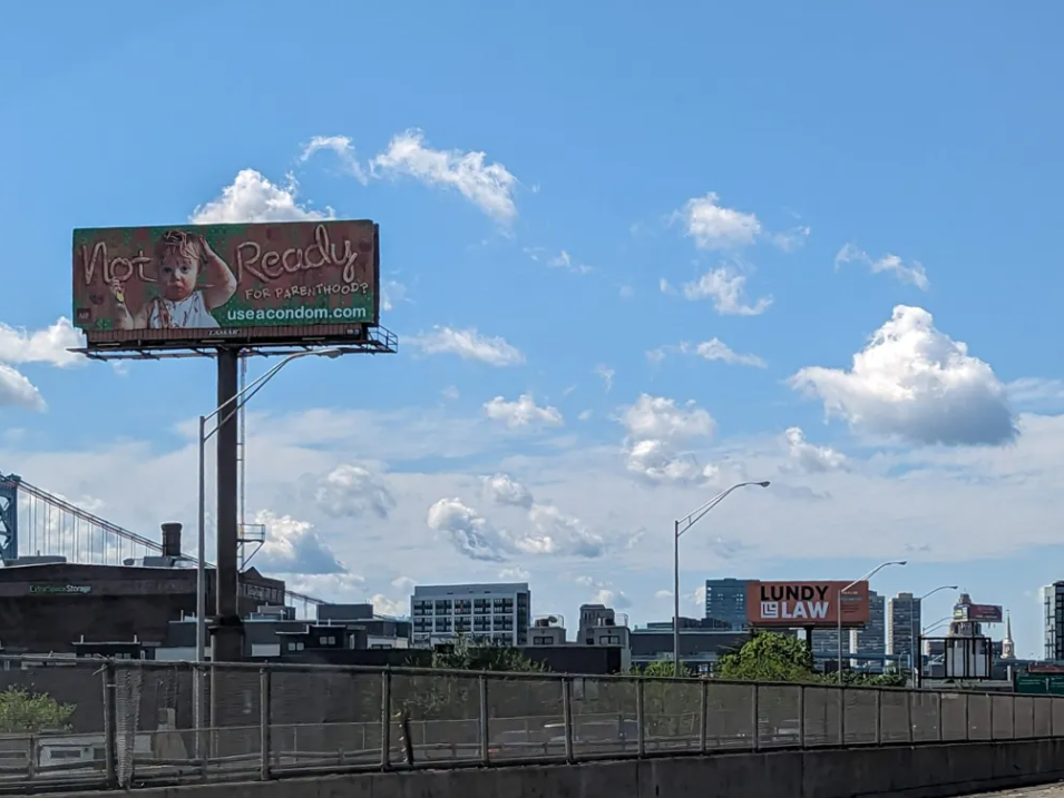 Billboard promoting the use of condoms along I-95 in Philadelphia. (Ella Lathan for Billy Penn)